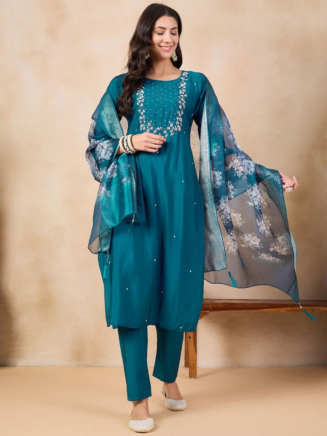 Step into elegance with this teal blue kurti set, adorned with intricate embroidery and a beautifully printed dupatta. The rich color and delicate detailing make it a perfect choice for festive occasions and gatherings.