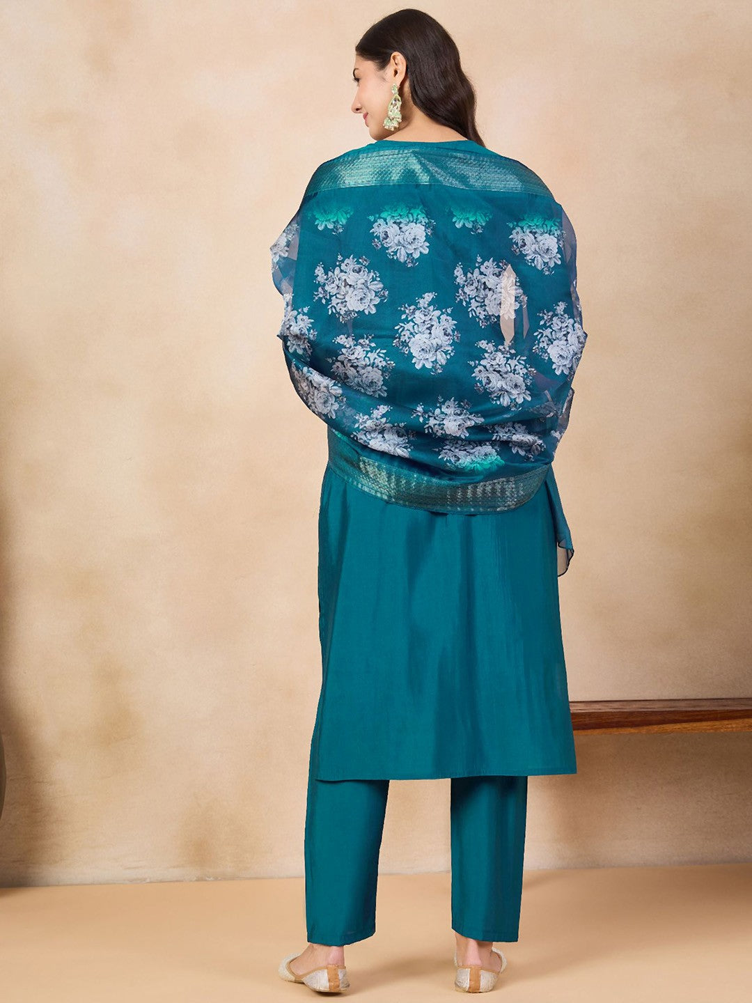 Step into elegance with this teal blue kurti set, adorned with intricate embroidery and a beautifully printed dupatta. The rich color and delicate detailing make it a perfect choice for festive occasions and gatherings.