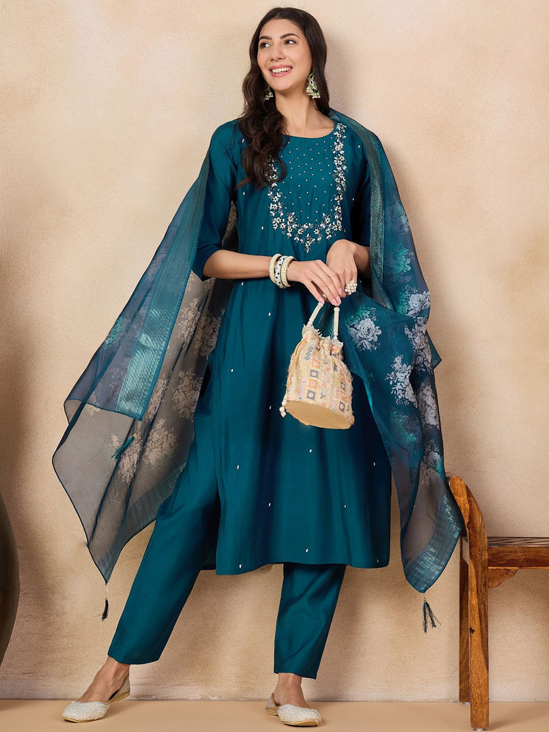 Step into elegance with this teal blue kurti set, adorned with intricate embroidery and a beautifully printed dupatta. The rich color and delicate detailing make it a perfect choice for festive occasions and gatherings.