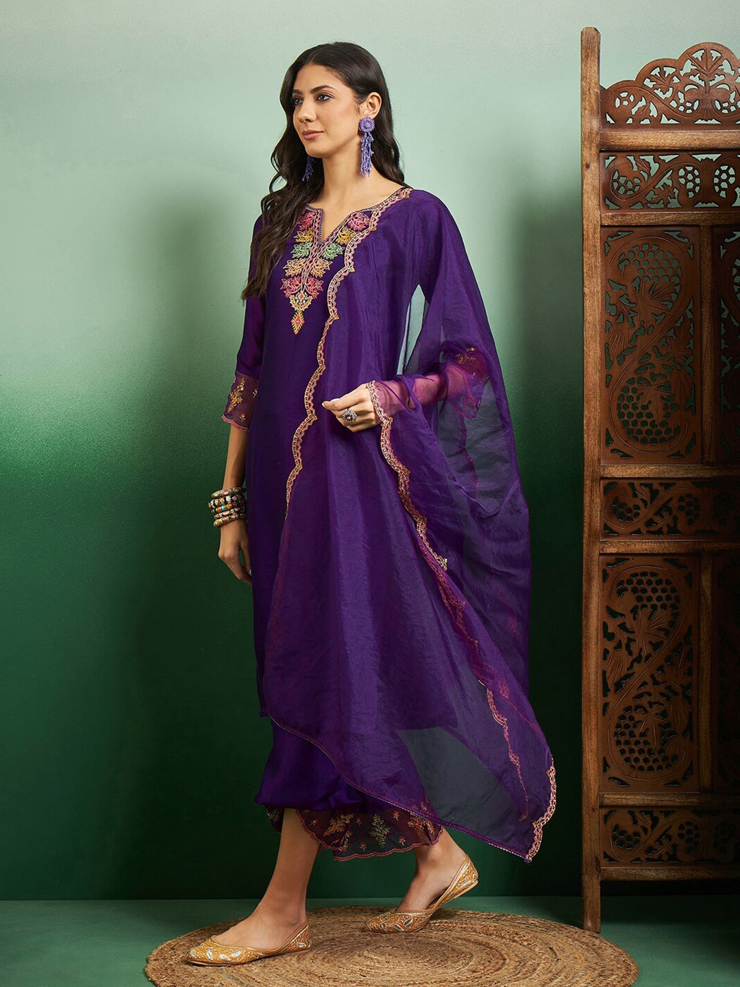 Elevate your style with this regal purple kurti set, adorned with intricate embroidery and delicate scalloped detailing