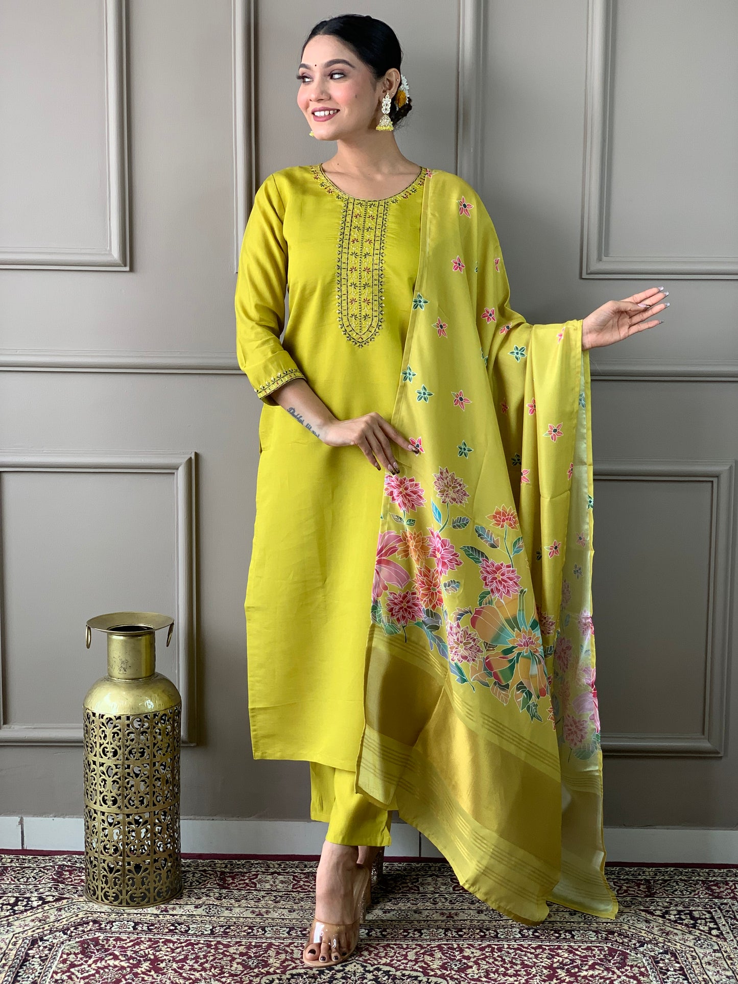 Brighten up your wardrobe with this elegant yellow kurti set, featuring delicate embroidery and a floral-printed dupatta