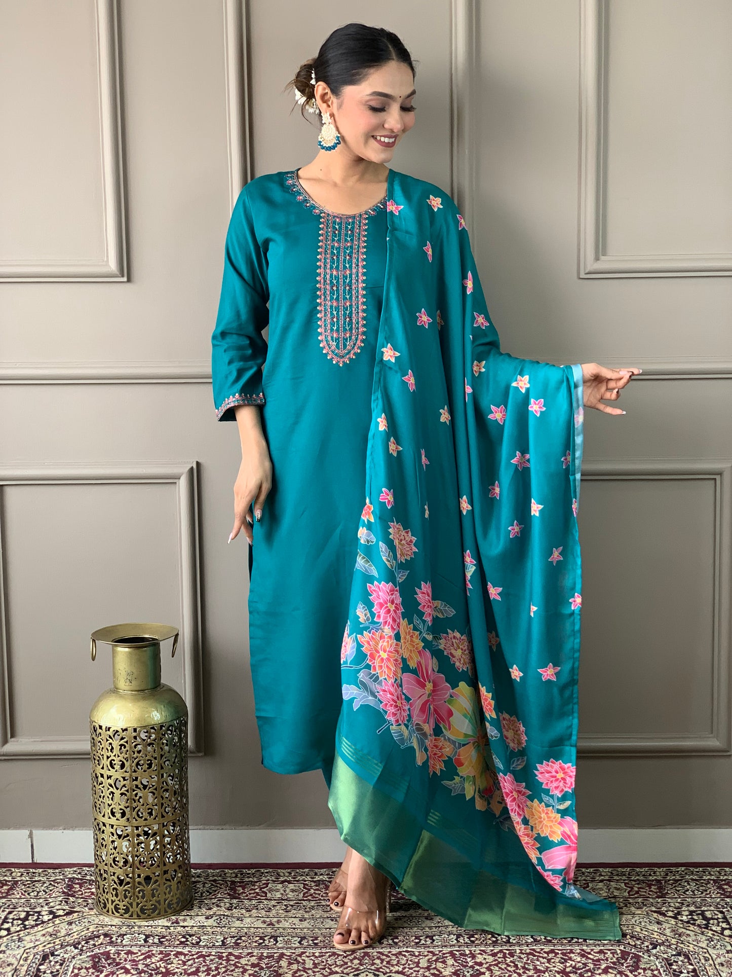 Brighten up your wardrobe with this elegant yellow kurti set, featuring delicate embroidery and a floral-printed dupatta