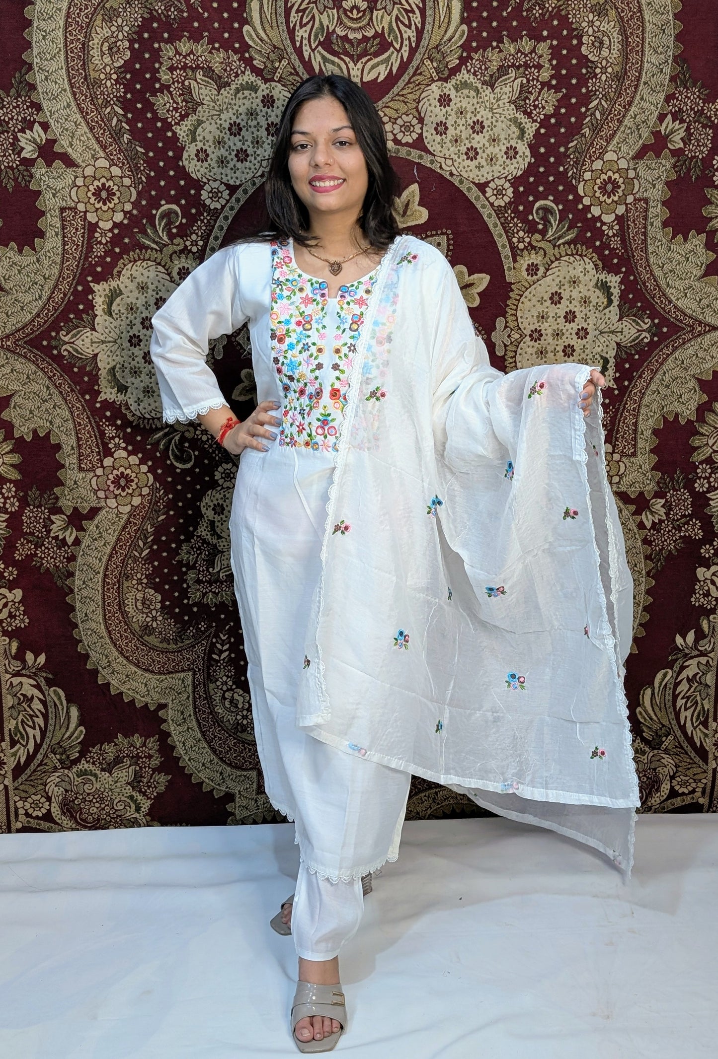 Elevate your elegance with this pristine white kurti set, featuring exquisite multicolor embroidery on the neckline