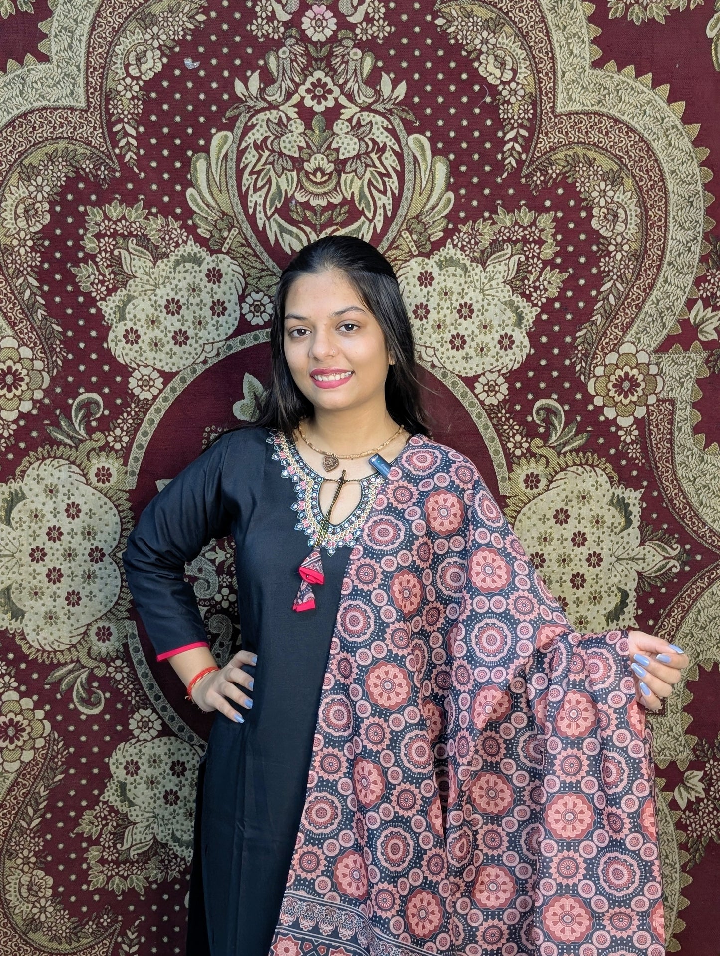 Exude elegance in this black kurti set, highlighted by intricate embroidery around the neckline and a beautifully printed dupatta in earthy tones. A perfect pick for graceful gatherings, this ensemble brings together simplicity and sophistication.