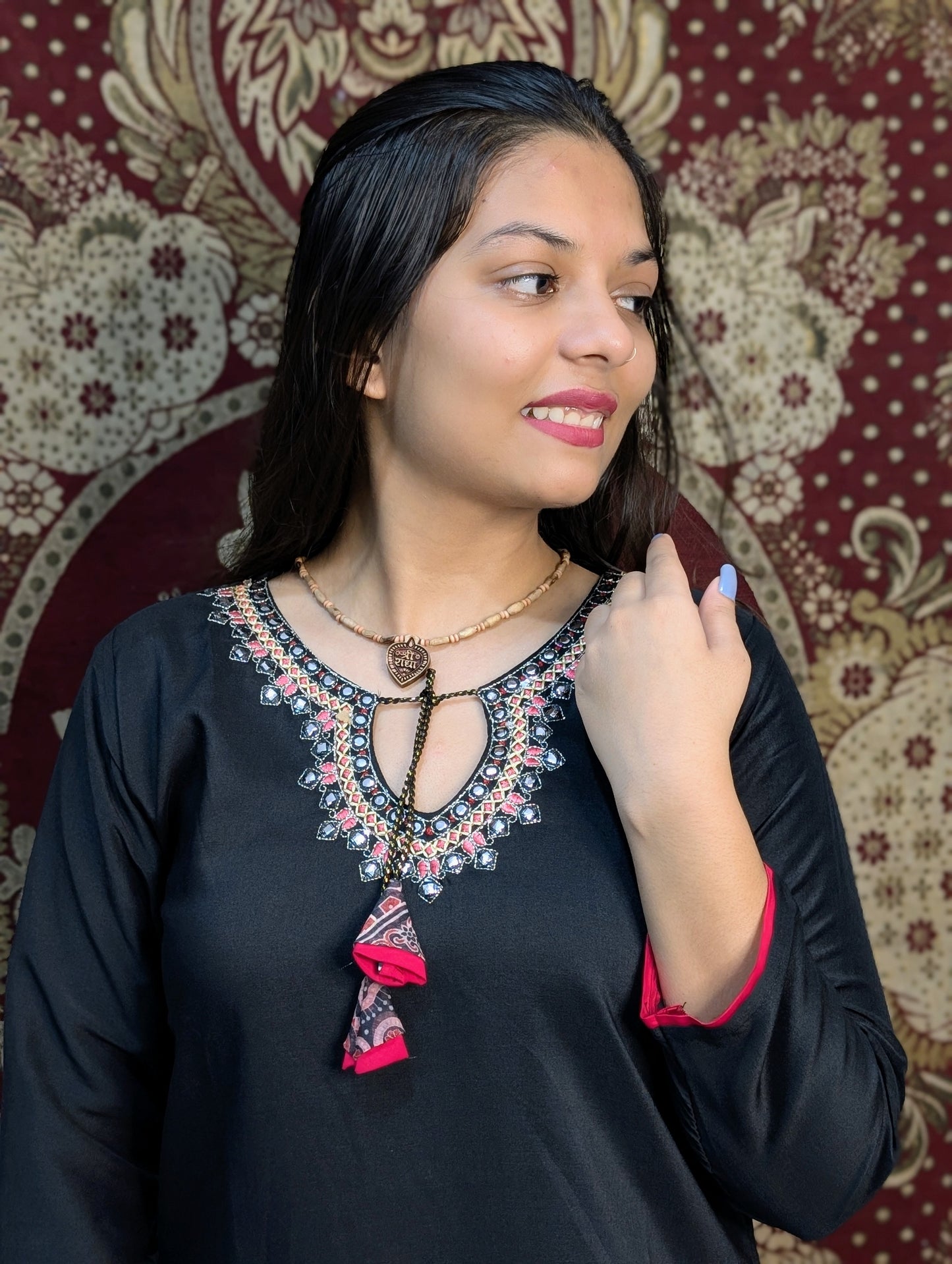 Exude elegance in this black kurti set, highlighted by intricate embroidery around the neckline and a beautifully printed dupatta in earthy tones. A perfect pick for graceful gatherings, this ensemble brings together simplicity and sophistication.