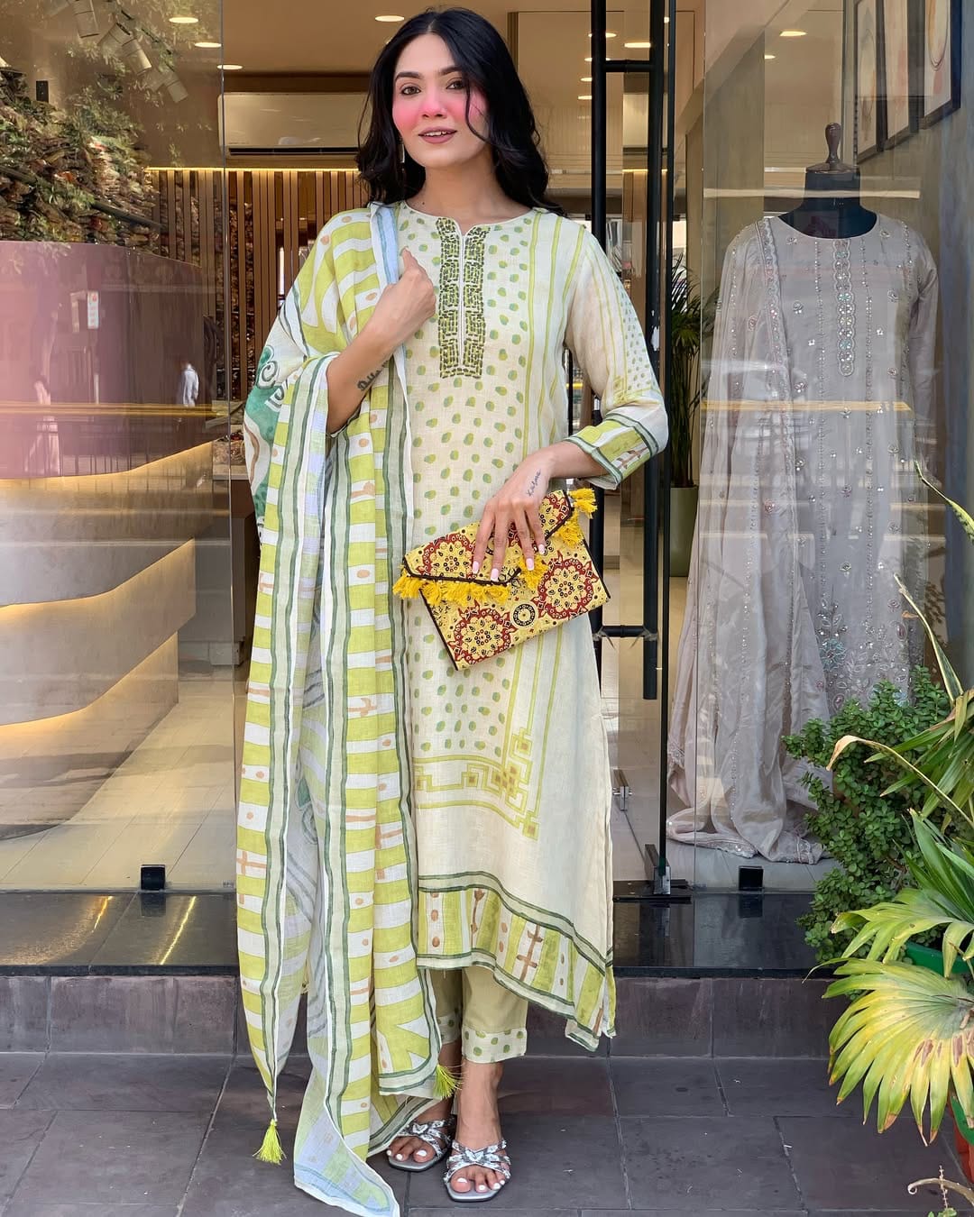 Brighten your wardrobe with this charming pastel green kurti set featuring playful polka dot prints and fine embroidery. Paired with a striped dupatta and matching pants, it's perfect for a light, breezy, and elegant daytime look.