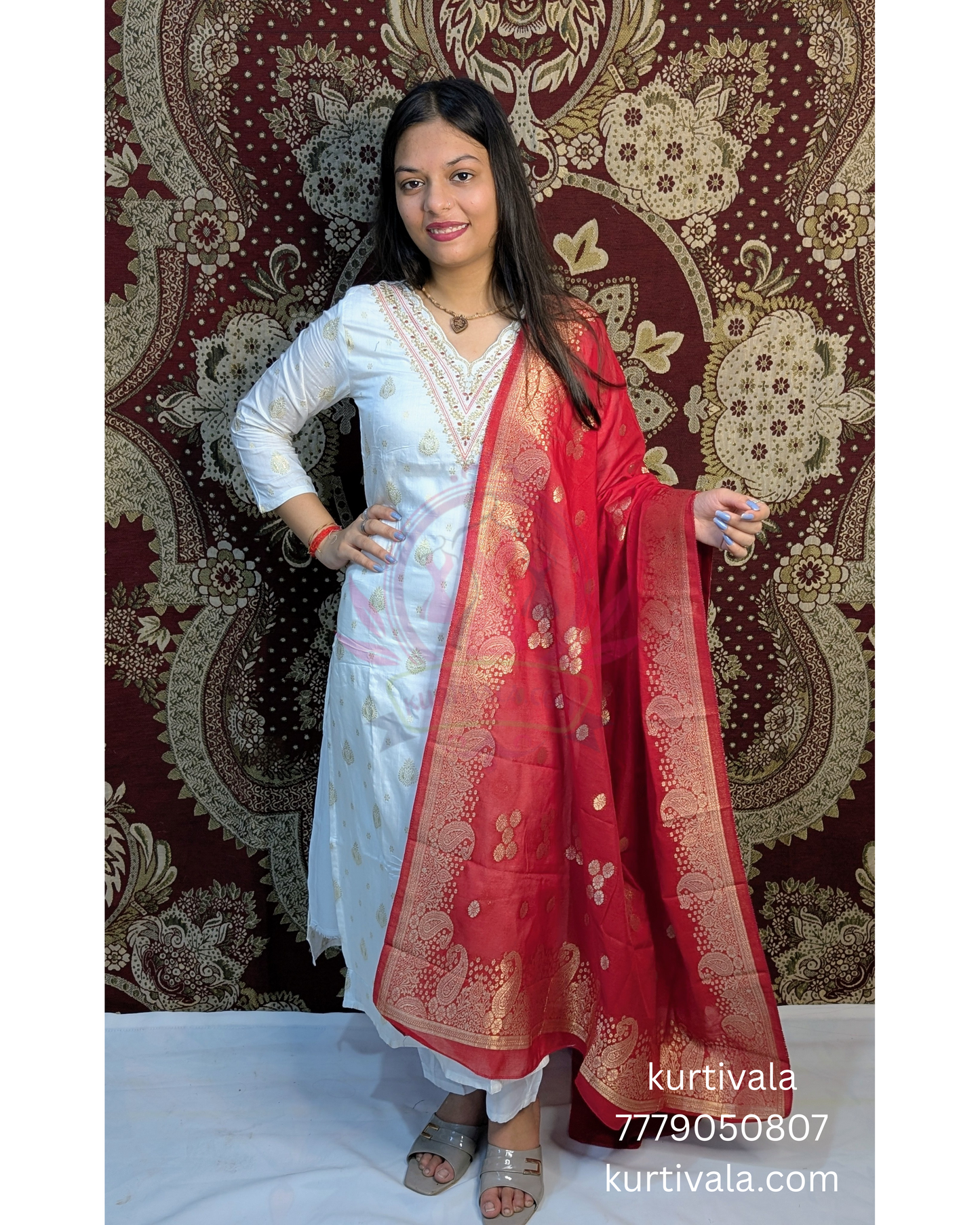 Radiate elegance in this white kurti set paired with a rich red Banarasi dupatta. Featuring delicate embroidery on the neckline and golden motifs on the dupatta, it's perfect for traditional functions, festive events, and graceful everyday wear