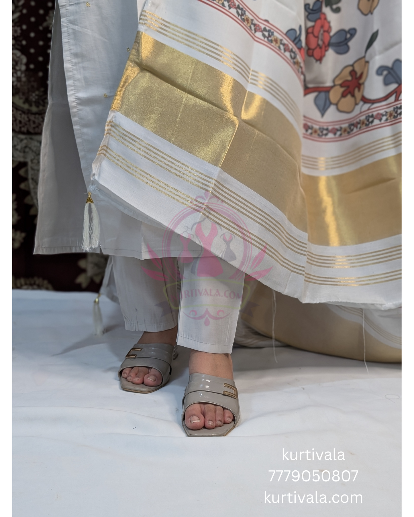 This soft pastel kurti set brings grace and charm with delicate embroidery on the neckline and a vibrant floral dupatta with golden zari borders. Ideal for festive wear or special occasions, it blends elegance with comfort effortlessly