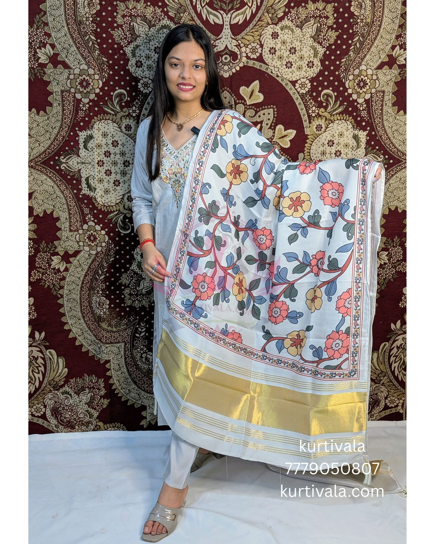 This soft pastel kurti set brings grace and charm with delicate embroidery on the neckline and a vibrant floral dupatta with golden zari borders. Ideal for festive wear or special occasions, it blends elegance with comfort effortlessly